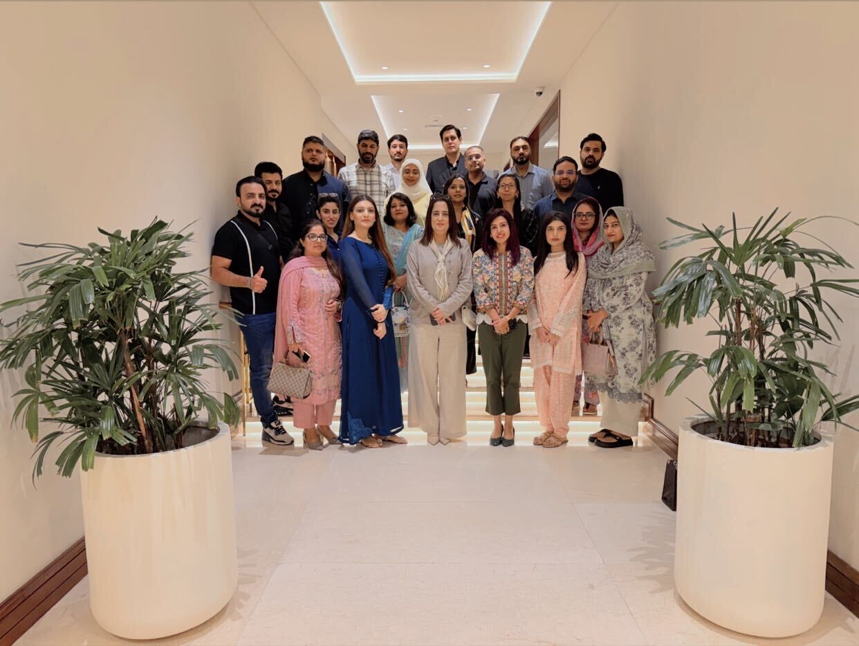 A cross-functional group of leaders gathered after a learning session